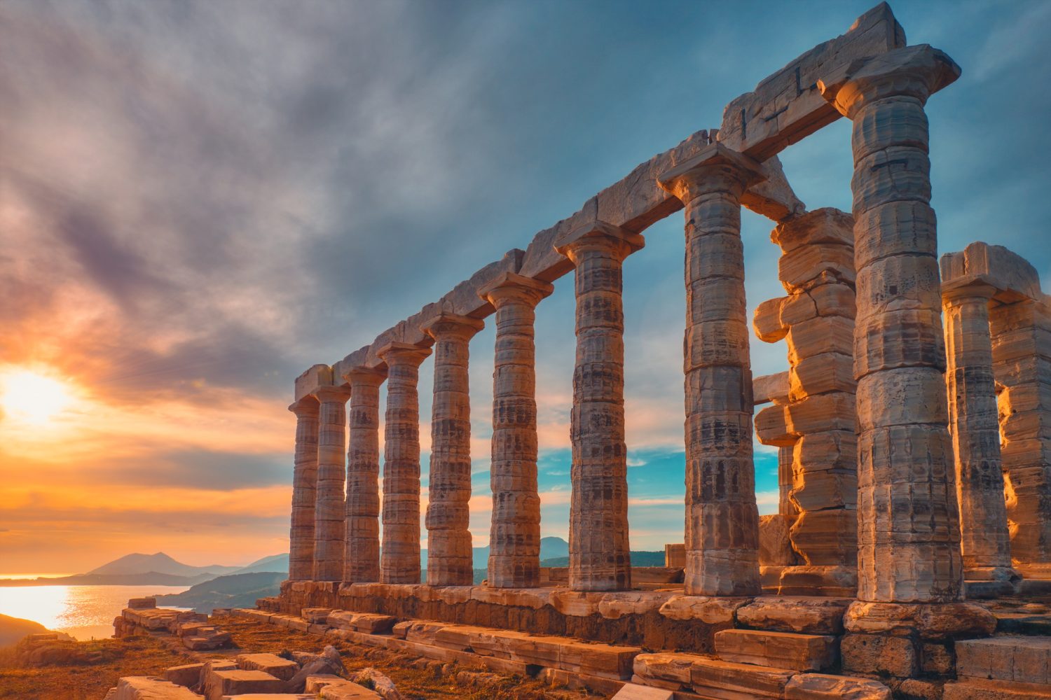 Poseidon temple ruins on Cape Sounio on sunset, Greece